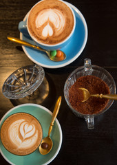 Cup of art shaped designed latte or cappuccino coffee