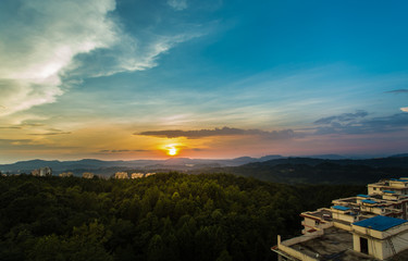 Peculiar beautiful sunset cloudscape and hilltop town in summer in Chongqing, China