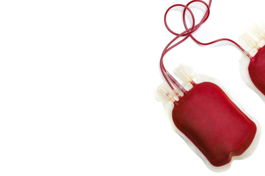 Two bags of donated human blood with no labels. Isolated on white background. Top view directly above with copy space. Blood donation blood trasfusion