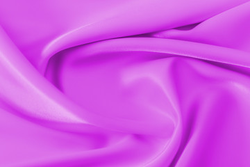 Smooth elegant shiny magenta silk or satin luxury cloth texture can use as abstract holidays background. Luxurious Christmas background or New Year background design.