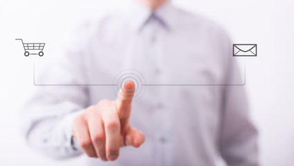 Male finger are pressing an imaginary button on bokeh, web shopping concept.