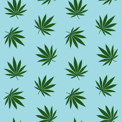 green leaves cannabis marijuana drug herb on a blue background pattern seamless vector