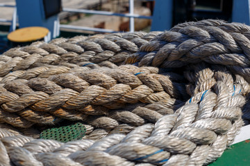 Fototapeta na wymiar twisted ship's rope lying on the deck