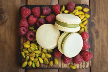 french macaron and pistachio on white background