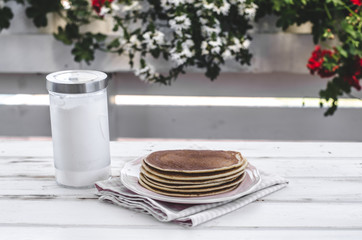 Vintage pancakes outside garden with blueberries