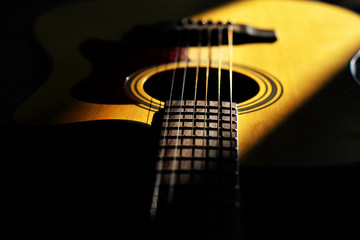 The guitar with lighting and black color background