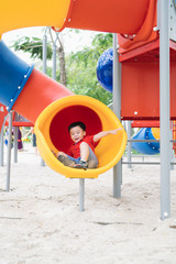 children playing on playground in summer outdoor park