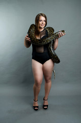 sensual girl and python in the studio
