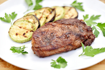 Meat cooked on a grill. Fried beef steak. Healthy food. Restaurant main course.