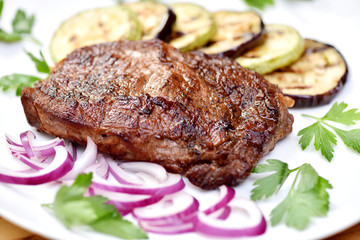 Meat cooked on a grill. Fried beef steak. Healthy food. Restaurant main course.