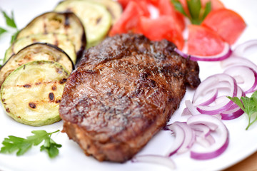 Meat cooked on a grill. Fried beef steak. Healthy food. Restaurant main course.