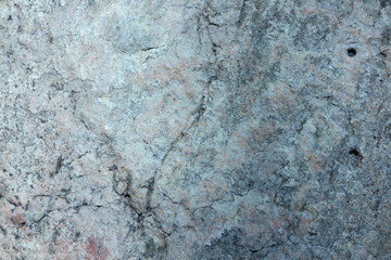 Granite texture for the designer. Granite stone close up. Background of natural material. Rocky rocks of ancient times. Natural pattern