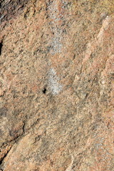 Granite texture for the designer. Granite stone close up. Background of natural material. Rocky rocks of ancient times. Natural pattern