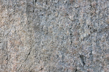 Granite texture for the designer. Granite stone close up. Background of natural material. Rocky rocks of ancient times. Natural pattern