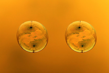 Soap bubbles on a golden background