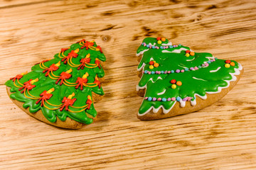 Gingerbread christmas trees on a wooden table