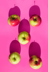 apple pink lilac shadow light yellow background vintage lot red in orange black top view above dreen