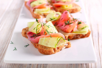 Salmon and cucumber over brown bread