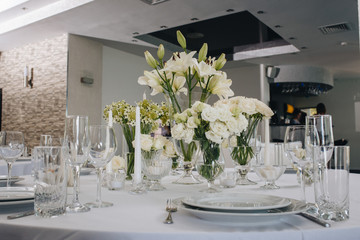 A very nicely decorated wedding table with plates, serviettes and signs. Scandinavian style. Sample and clean.