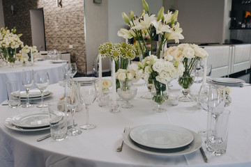 A very nicely decorated wedding table with plates, serviettes and signs. Scandinavian style. Sample and clean.