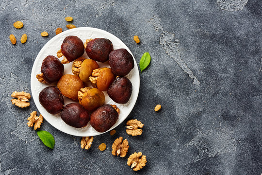 Dessert of dried apricots with walnuts. Top view of Hashtak.