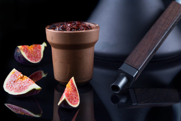 Shisha with Apple flavor in a clay bowl