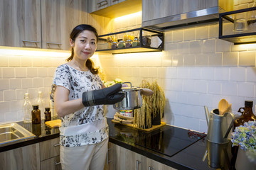 Cooking woman in kitchen and wooden spoon, with the text area empty to be filled in