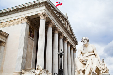 Fototapeta na wymiar The Austrian Parliament and Athena Fountain in Vienna, Austria