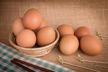 Set Eggs in a basket on  gunny (sackcloth)  background