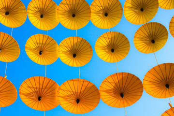 Pattern Yellow umbrellas on blue sky.