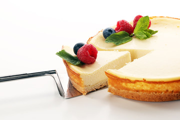 Homemade cheesecake with fresh raspberries and mint for dessert - healthy organic summer dessert pie cheesecake. Vanilla Cheese Cake