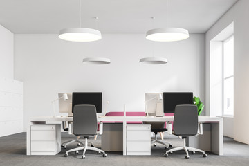 Computer tables in white office, couch