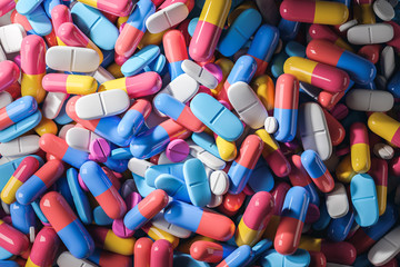 Fototapeta na wymiar Colorful pills background, medicine abstract