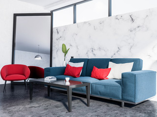 Marble living room corner, blue sofa, red armchair