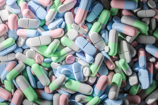 Pills of pastel colors background