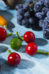 autumn vegetables with shadow on worn blue wood table background