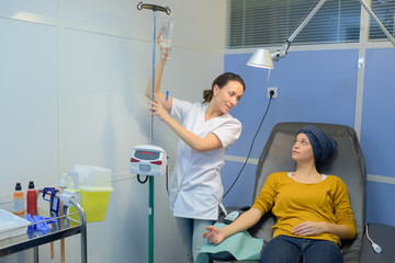 Young lady being connected up for chemotherapy