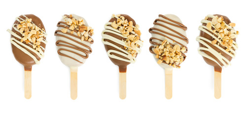 set of five cake pops in chocolate glaze in form of ice cream isolated on white