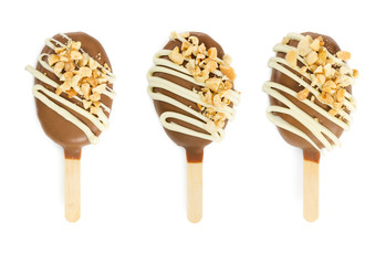 Set of cake pops in chocolate glaze in form of ice cream isolated on white