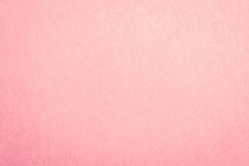 Fototapeta premium Recycled craft paper textured background in light pink old rose color