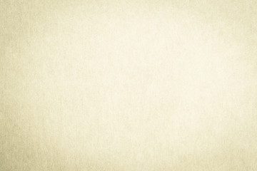 Recycled paper texture background in antique light yellow cream beige color