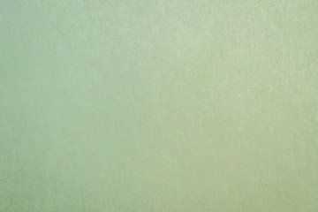 Recycled paper texture background in yellow green brown