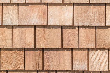 Obraz premium Shingle red cedar wooden shake wood siding row roof panel made of larch conifer tree