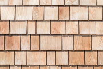 Fototapeta premium Shingle red cedar wooden shake wood siding row roof panel made of larch conifer tree