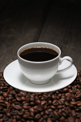 Cup of coffee and coffee beans