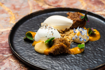 Fine dining dessert, Carrot cake,caramel ice cream, white chocolate mousse and spices