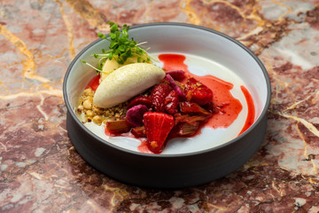 Fine dining dessert, Strawberries Parfait, ice cream, white chocolate mousse and spices