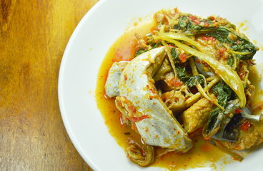spicy fried striped catfish with herb and curry on plate