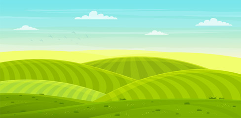 Sunny rural landscape with hills and fields. Summer green hills, meadows and fields with a dawn, blue sky in the clouds.