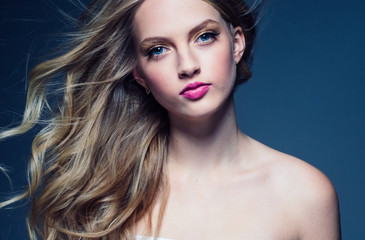 Fototapeta premium Beautiful blonde woman with pink lipstick beauty model